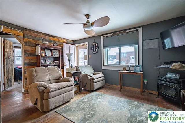 a living room with furniture and a window