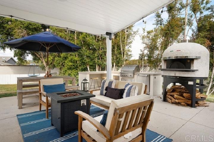 436 Alviso Way Encinitas, CA 92024 - Photo 1 of 18 a view of an outdoor sitting area with furniture and barbeque grill