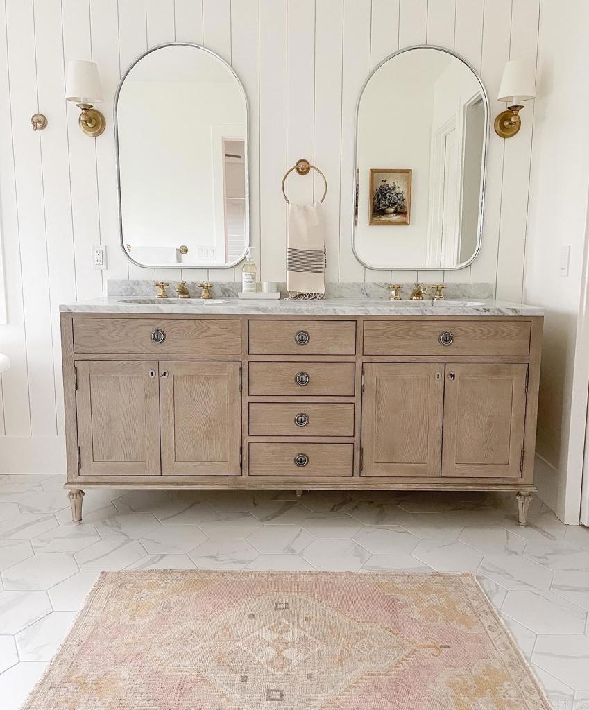 436 Alviso Way Encinitas, CA 92024 - Photo 12 of 18 a bathroom with a granite countertop double vanity sink and mirror
