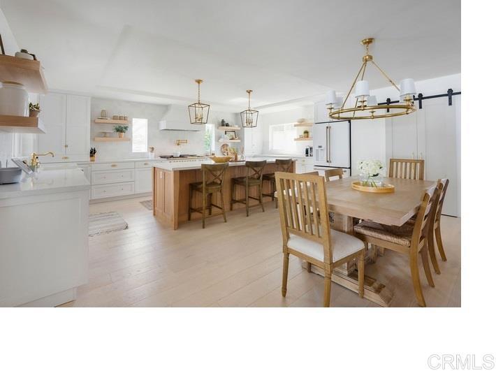 436 Alviso Way Encinitas, CA 92024 - Photo 6 of 18 a dining room with furniture and a chandelier