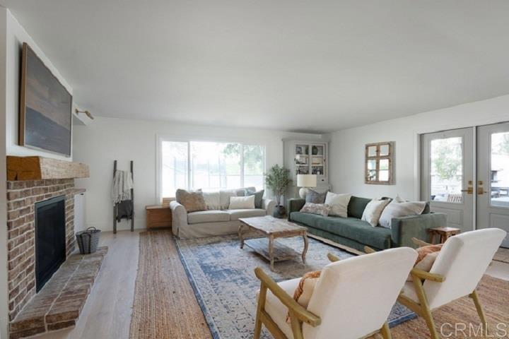 436 Alviso Way Encinitas, CA 92024 - Photo 8 of 18 a living room with fireplace furniture and a fireplace