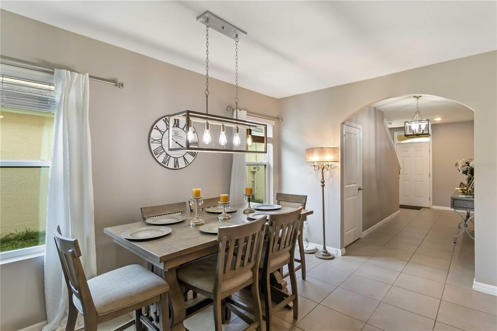 5904 Silver Sage Way Sarasota, FL 34232 - Photo 17 of 43 a view of a dining room furniture and chandelier