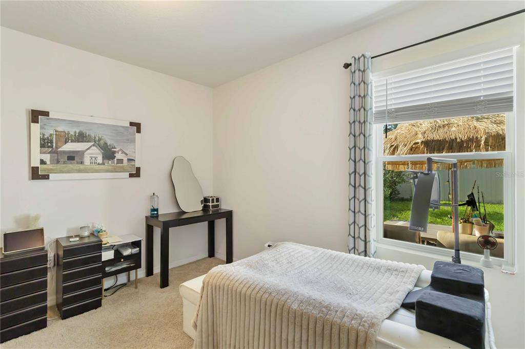 5904 Silver Sage Way Sarasota, FL 34232 - Photo 20 of 43 a bedroom with a bed and a window