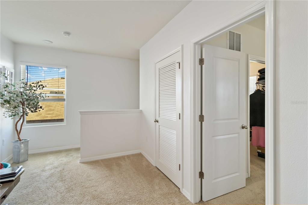 5904 Silver Sage Way Sarasota, FL 34232 - Photo 21 of 43 a view of a interior in the hallway