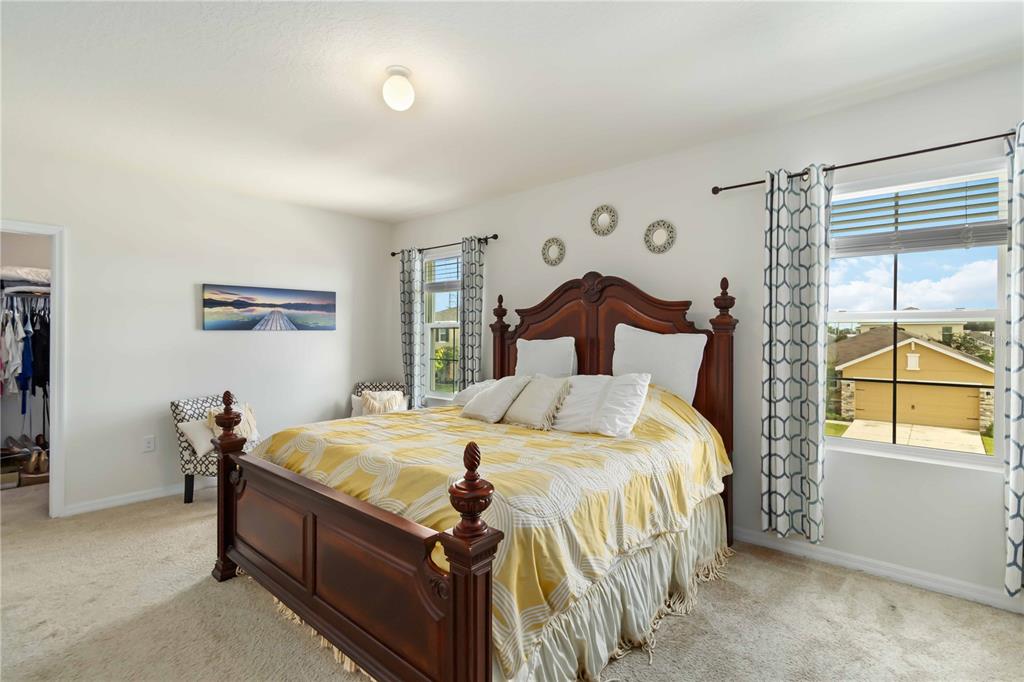 5904 Silver Sage Way Sarasota, FL 34232 - Photo 22 of 43 a bedroom with a bed and a window