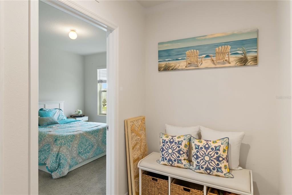 5904 Silver Sage Way Sarasota, FL 34232 - Photo 31 of 43 a bedroom with a bed and a table in it