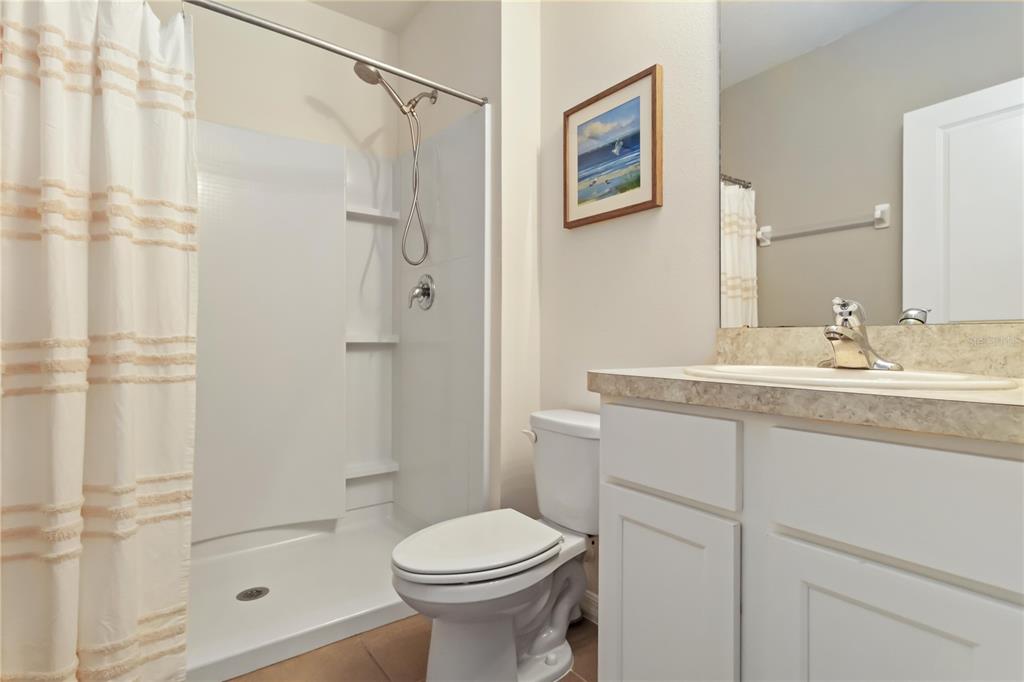 5904 Silver Sage Way Sarasota, FL 34232 - Photo 33 of 43 a bathroom with a sink toilet and shower
