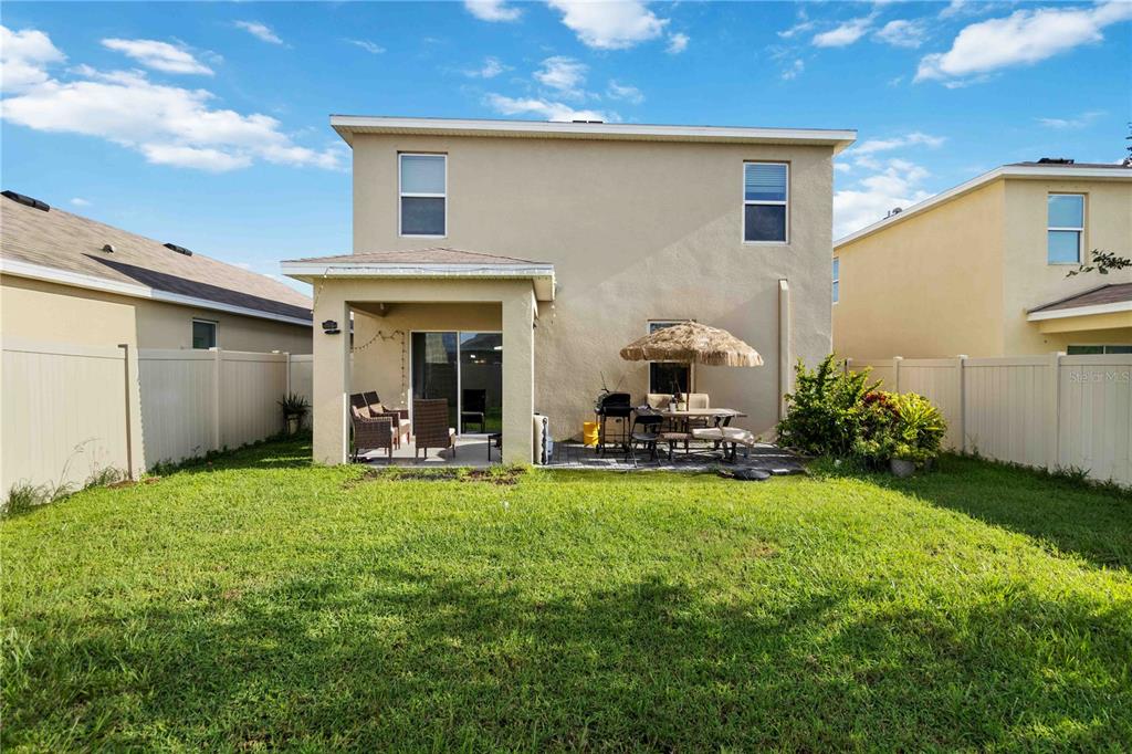 5904 Silver Sage Way Sarasota, FL 34232 - Photo 39 of 43 a view of a house with backyard sitting area and garden