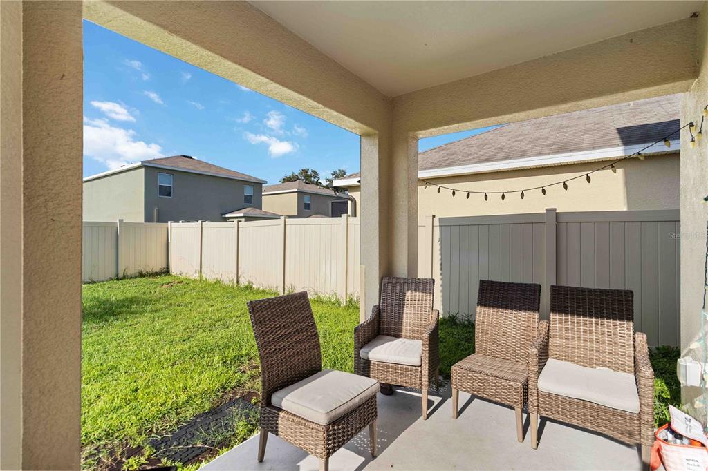 5904 Silver Sage Way Sarasota, FL 34232 - Photo 40 of 43 a balcony with furniture and a potted plant