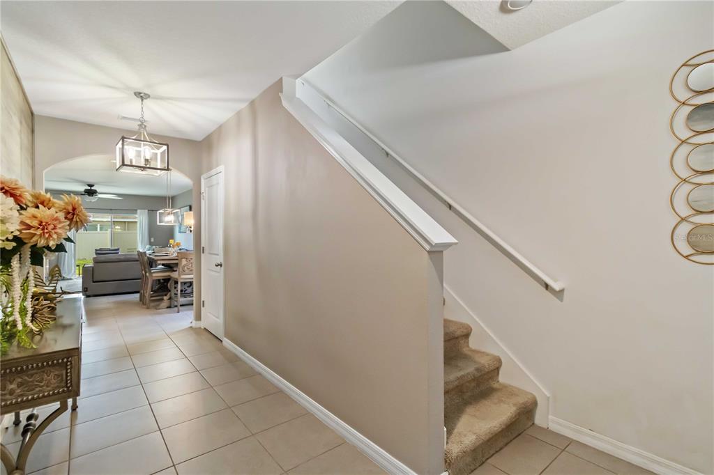 5904 Silver Sage Way Sarasota, FL 34232 - Photo 5 of 43 a view of a livingroom with kitchen and furniture