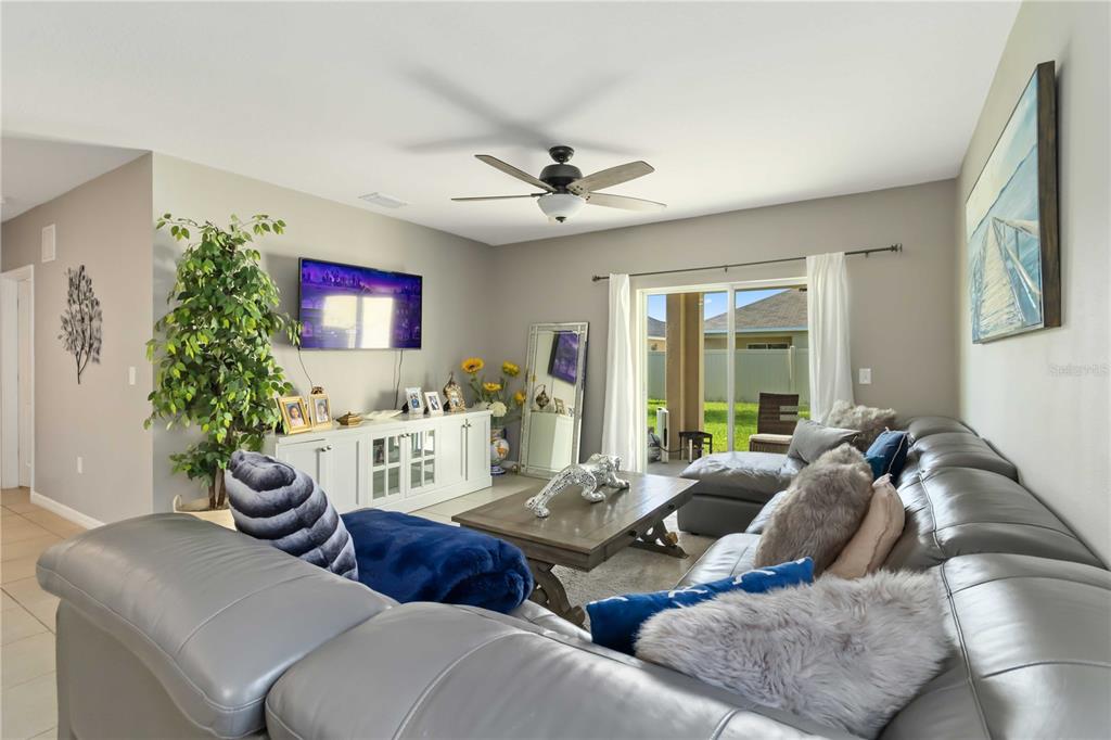 5904 Silver Sage Way Sarasota, FL 34232 - Photo 7 of 43 a living room with furniture and a large window