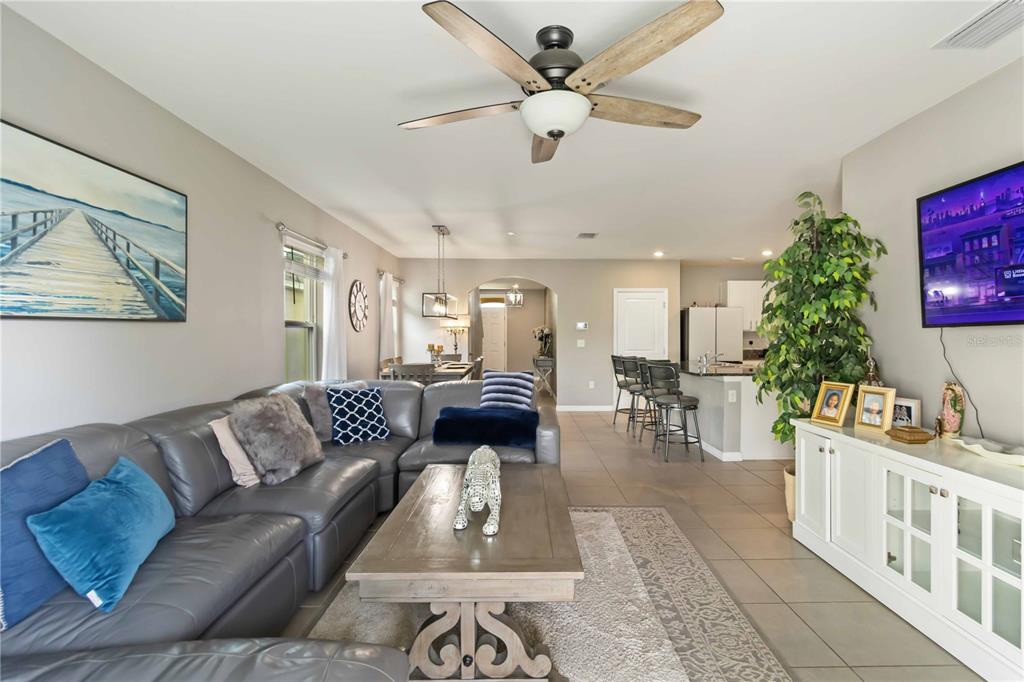 5904 Silver Sage Way Sarasota, FL 34232 - Photo 9 of 43 a living room with furniture and a chandelier