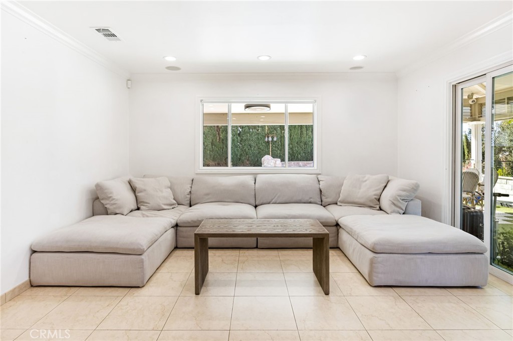 12115 Braemore Place Porter Ranch, CA 91326 - Photo 13 of 36 a living room with furniture and a large window