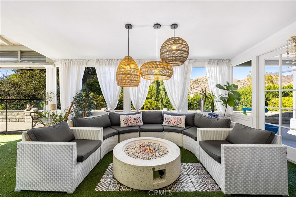 12115 Braemore Place Porter Ranch, CA 91326 - Photo 14 of 36 a living room with furniture and a large window