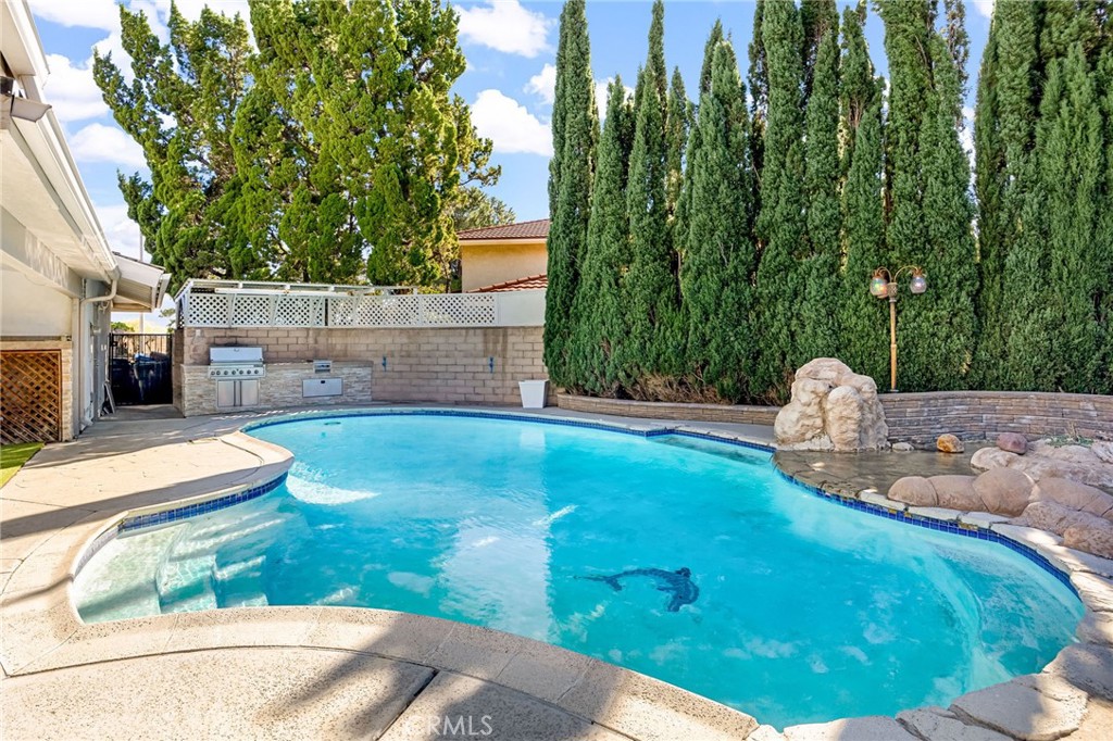 12115 Braemore Place Porter Ranch, CA 91326 - Photo 17 of 36 a view of a backyard with a fountain