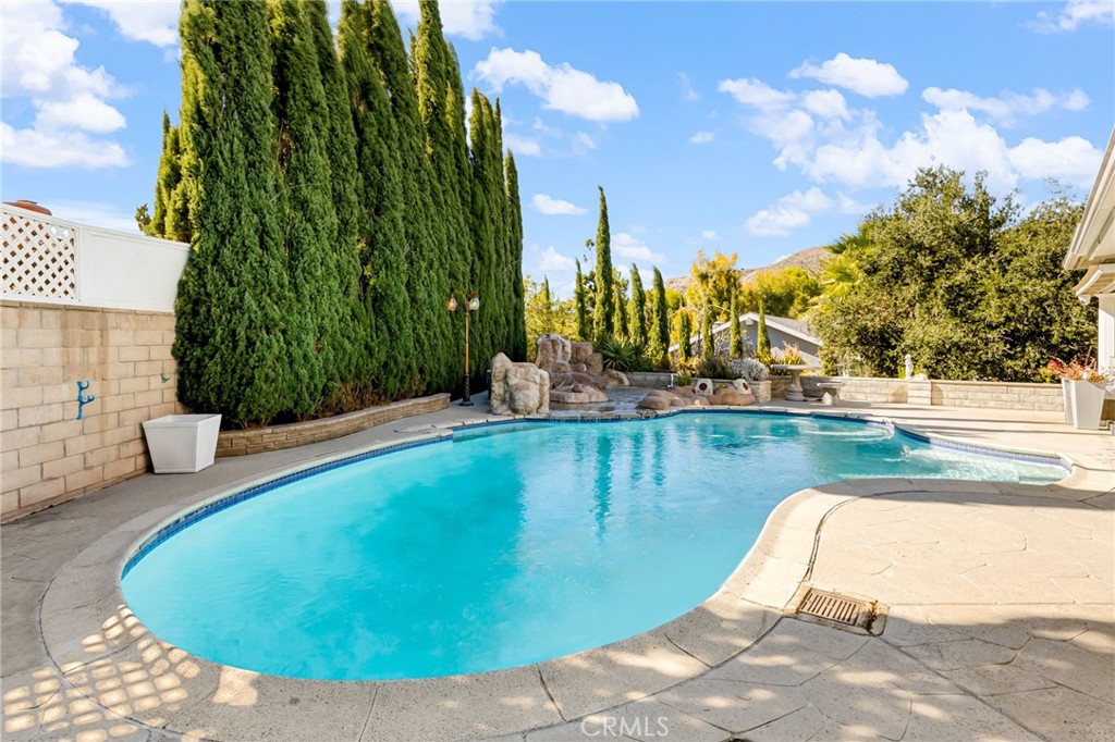 12115 Braemore Place Porter Ranch, CA 91326 - Photo 19 of 36 a view of a swimming pool with outdoor seating