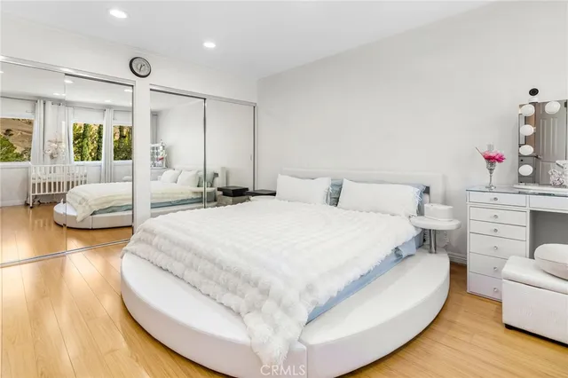 a large white bed in a white room