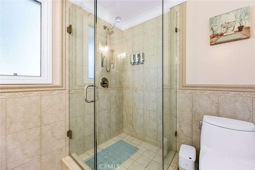12115 Braemore Place Porter Ranch, CA 91326 - Photo 29 of 36 a bathroom with a shower and toilet
