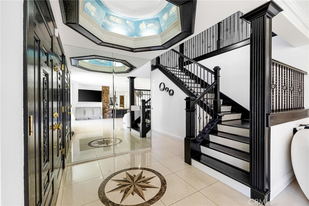 12115 Braemore Place Porter Ranch, CA 91326 - Photo 3 of 36 a view of entryway and hall with wooden floor