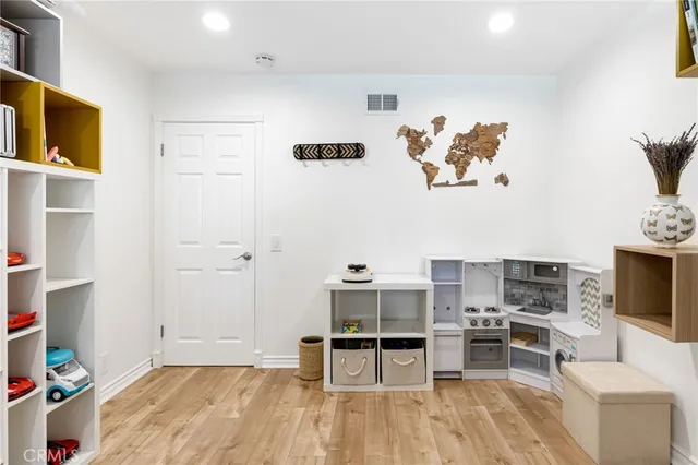 a view of a livingroom with furniture and a flat screen tv