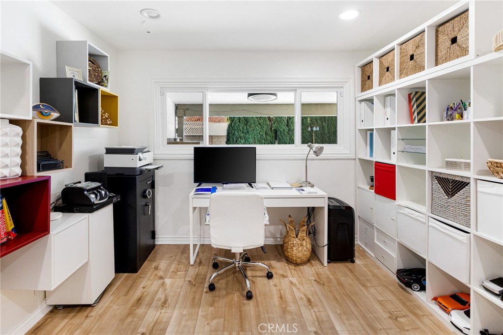 12115 Braemore Place Porter Ranch, CA 91326 - Photo 32 of 36 a view of a workspace with furniture and a kitchen