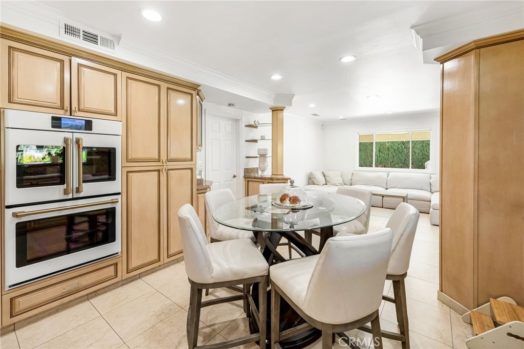 12115 Braemore Place Porter Ranch, CA 91326 - Photo 10 of 36 a view of a dining room with furniture and window