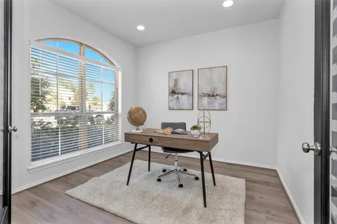 a workspace with furniture and a window