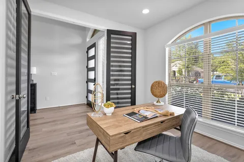 a living room with furniture and window