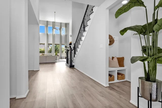 a view of entryway with wooden floor and stairs