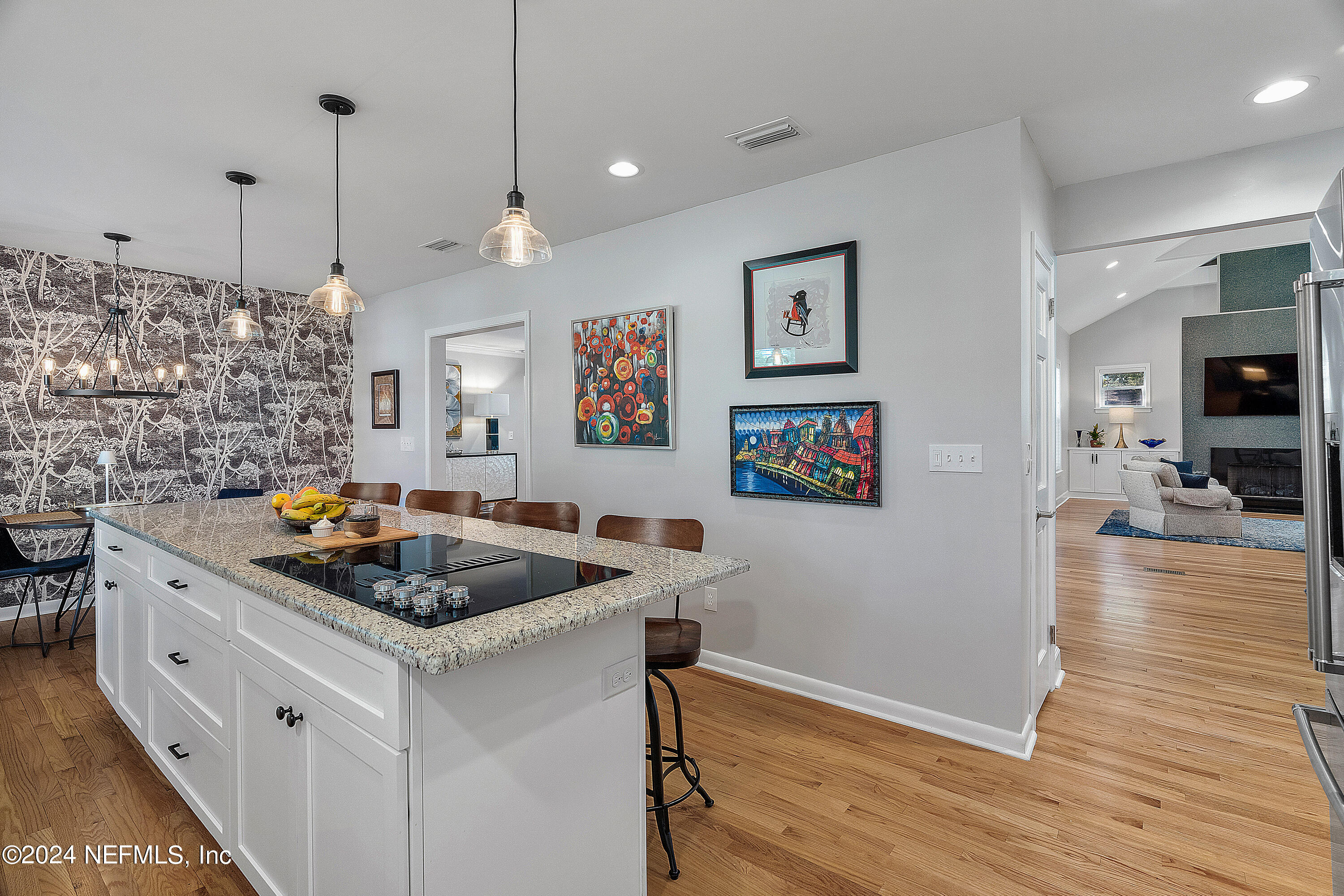 4724 Devon Lane Jacksonville, FL 32210 - Photo 12 of 40 a kitchen with stainless steel appliances granite countertop a sink stove and wooden floor