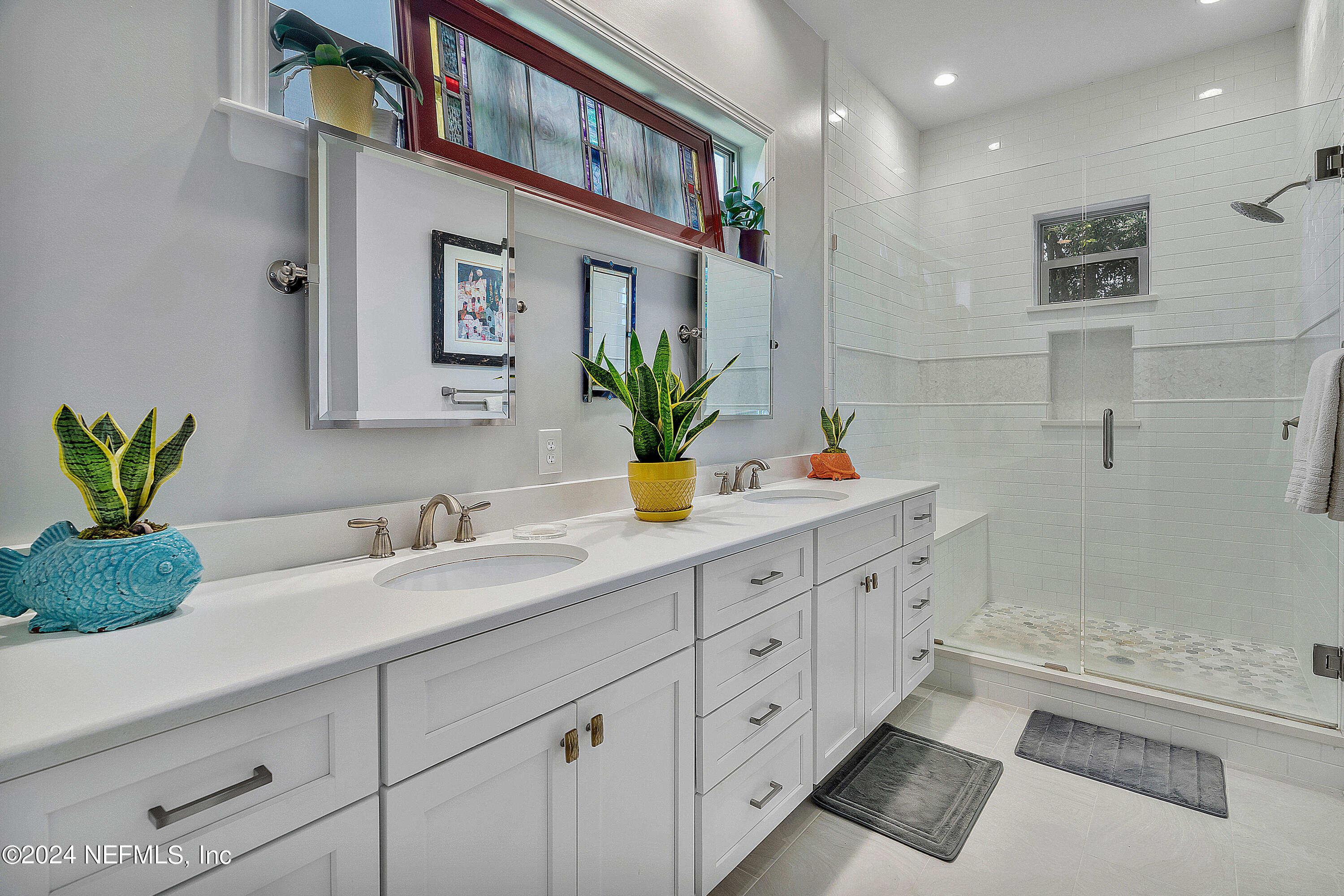 4724 Devon Lane Jacksonville, FL 32210 - Photo 20 of 40 a bathroom with a double vanity sink and a bathtub