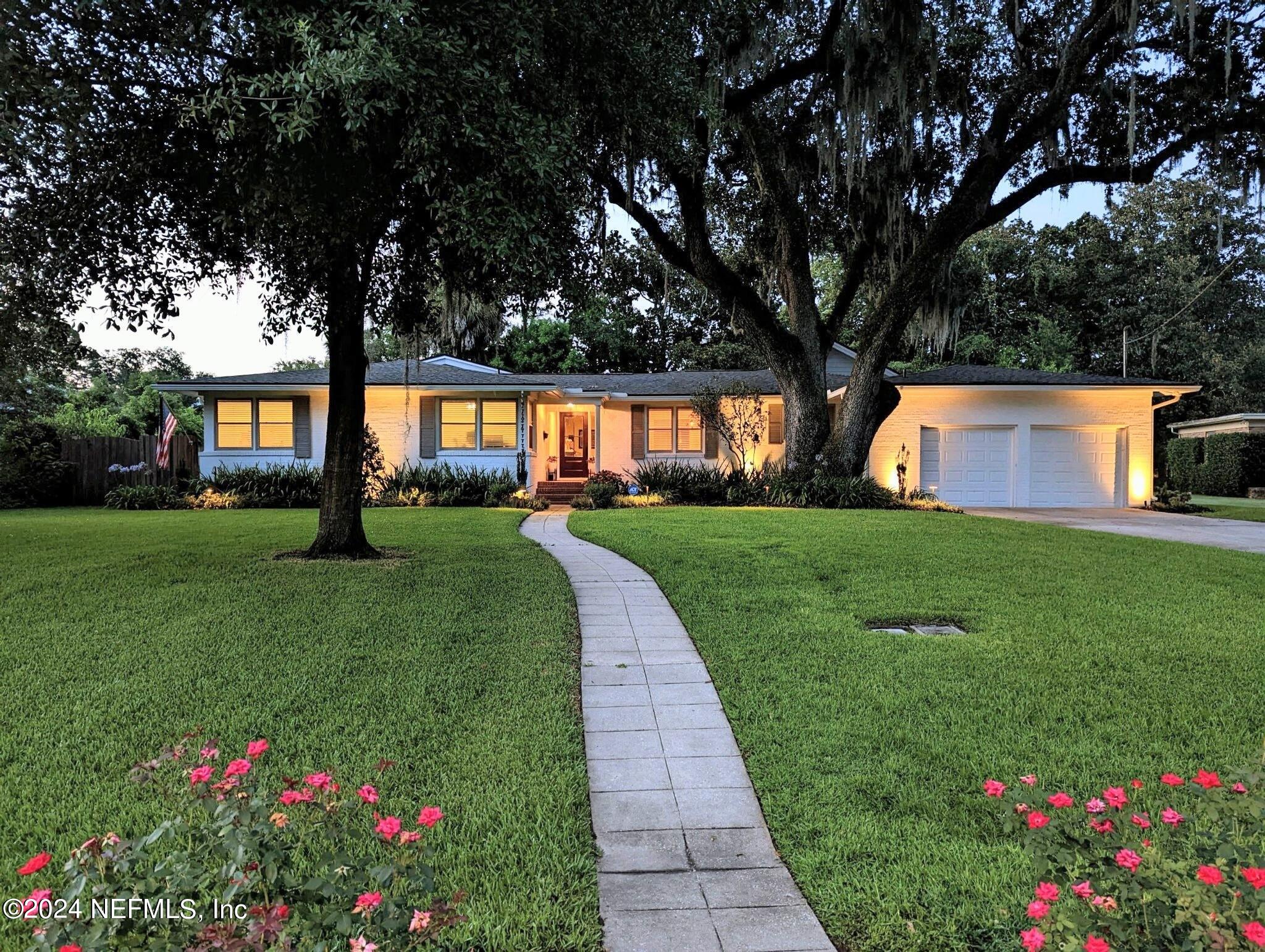 4724 Devon Lane Jacksonville, FL 32210 - Photo 2 of 40 a front view of house with yard and green space