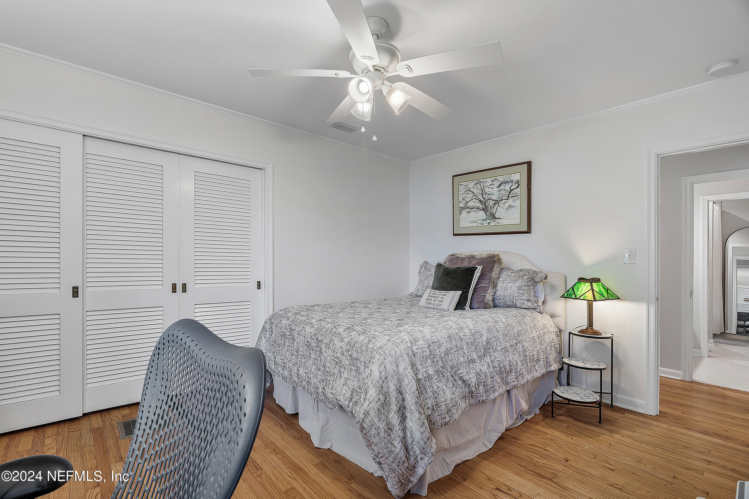 4724 Devon Lane Jacksonville, FL 32210 - Photo 22 of 40 a bedroom with a bed and wooden floor