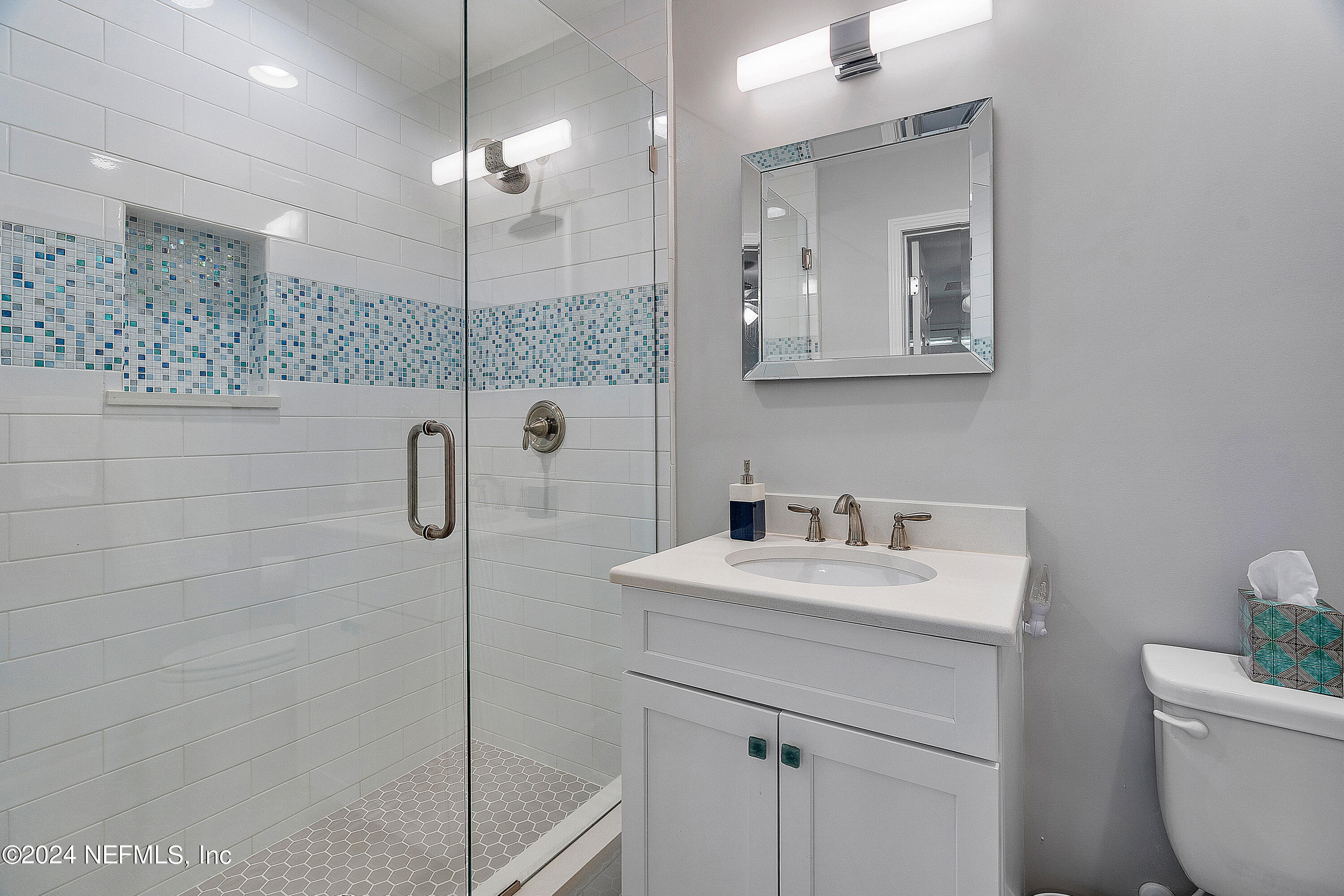 4724 Devon Lane Jacksonville, FL 32210 - Photo 27 of 40 a bathroom with a sink a toilet and shower