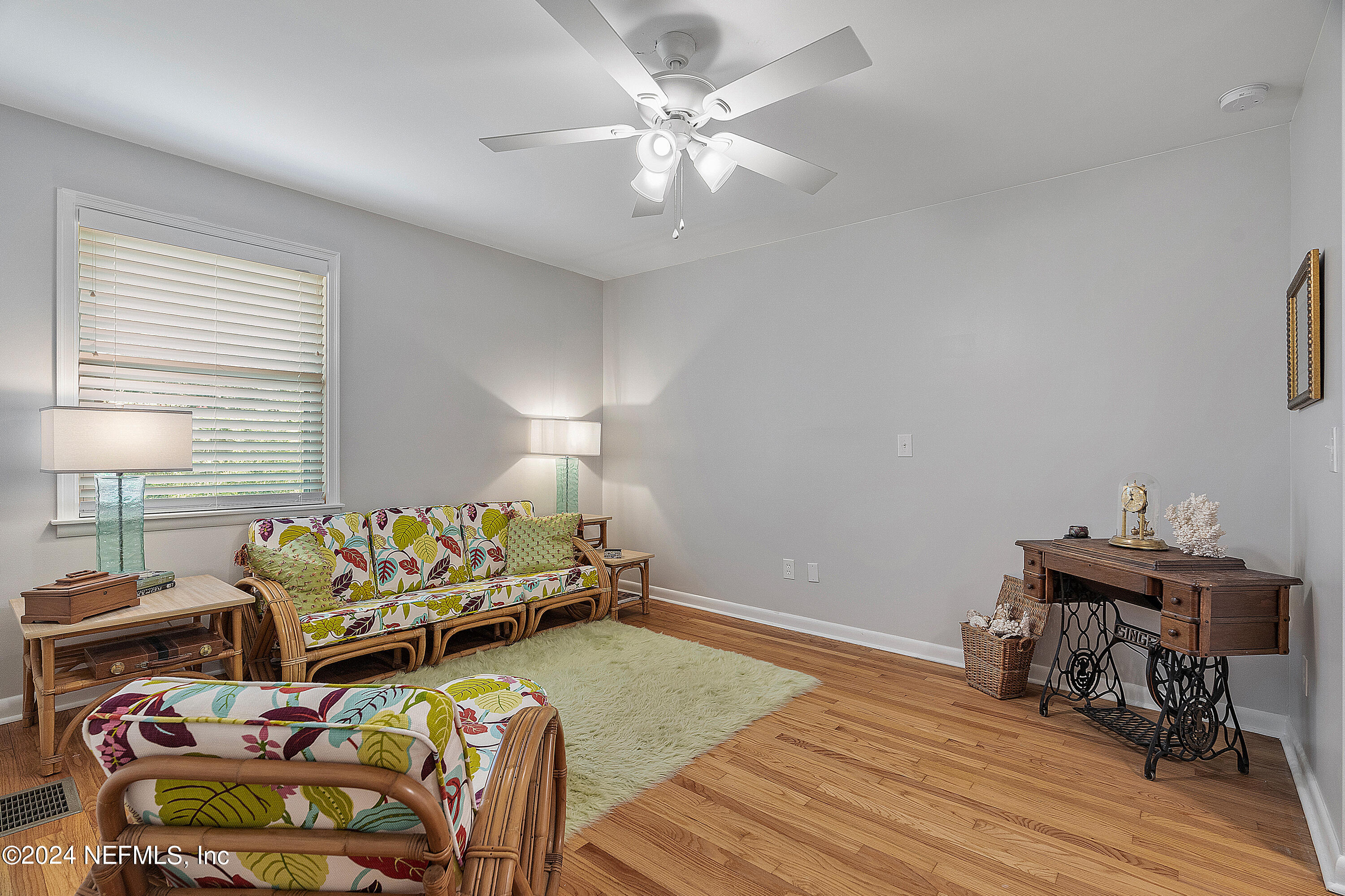 4724 Devon Lane Jacksonville, FL 32210 - Photo 28 of 40 a bed room with furniture and a wooden floor