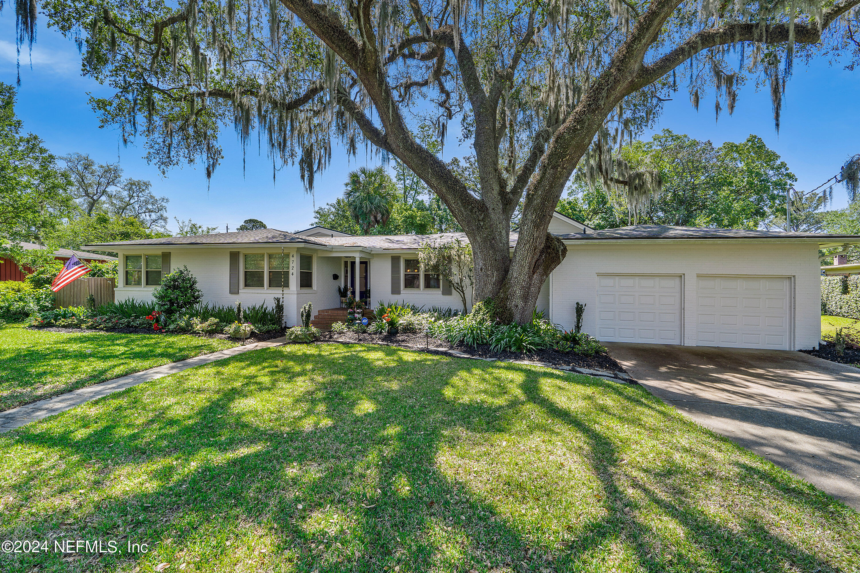 4724 Devon Lane Jacksonville, FL 32210 - Photo 3 of 40 a front view of a house with garden