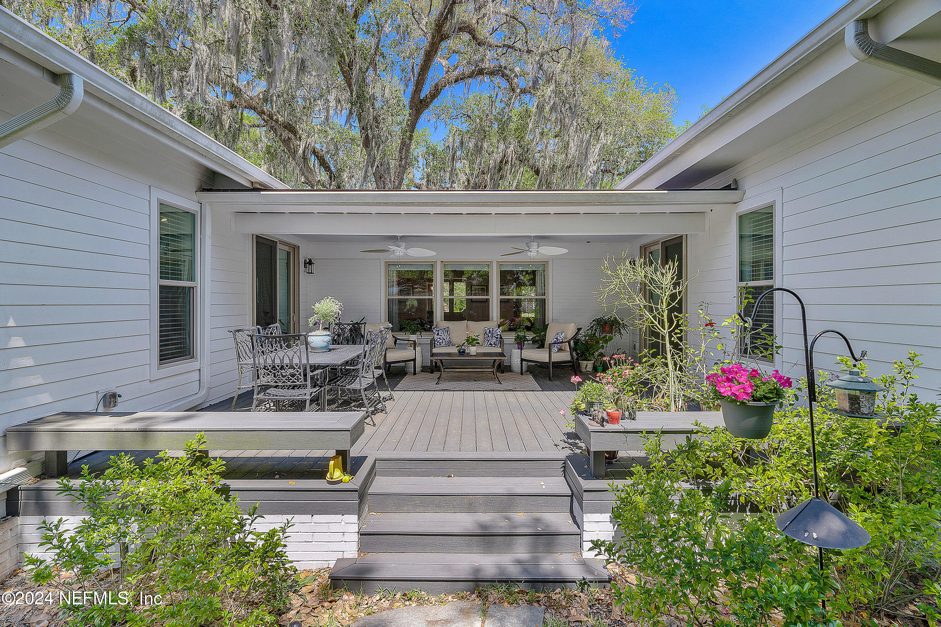 4724 Devon Lane Jacksonville, FL 32210 - Photo 31 of 40 a view of a house with sitting area and garden