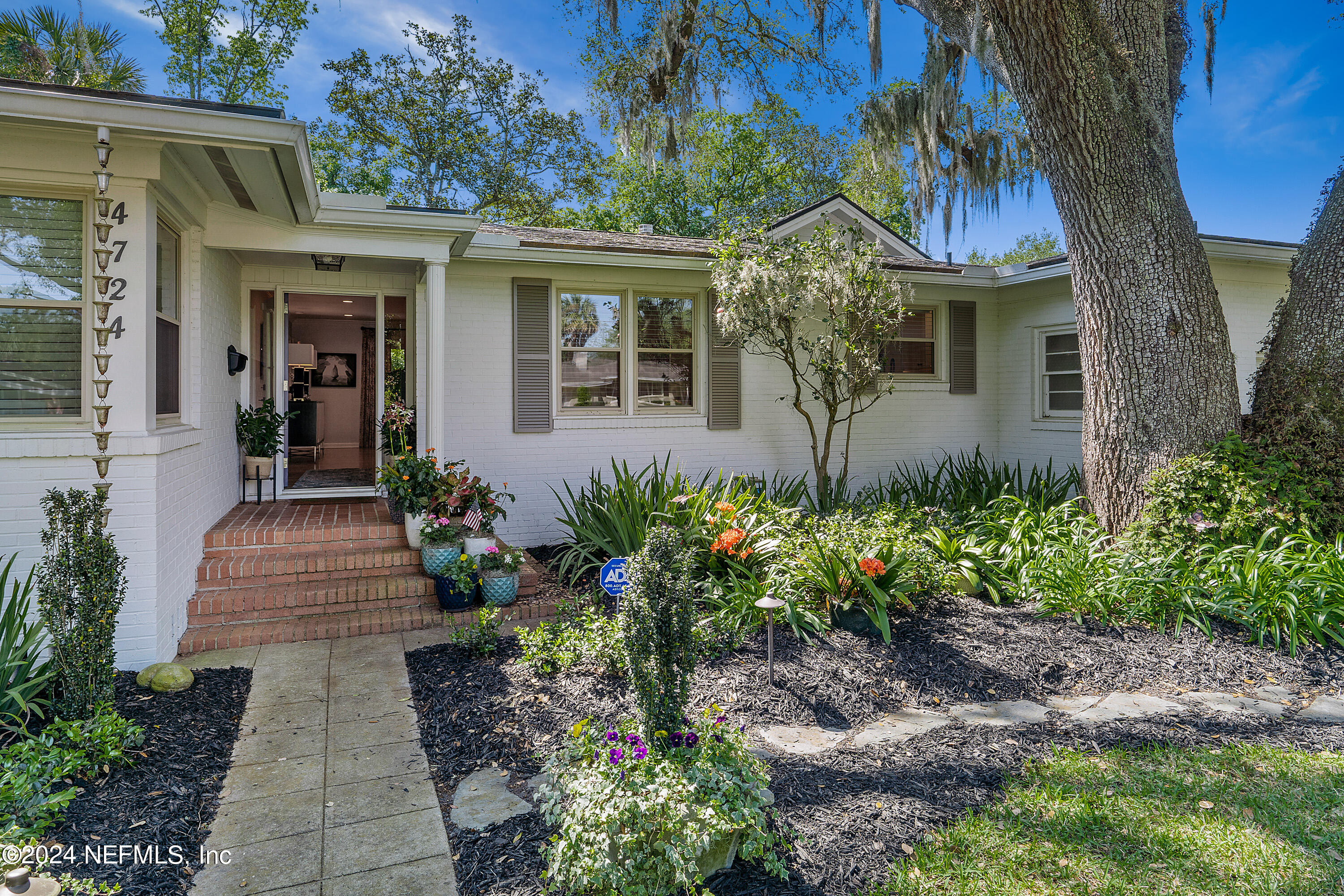 4724 Devon Lane Jacksonville, FL 32210 - Photo 5 of 40 a front view of a house with garden