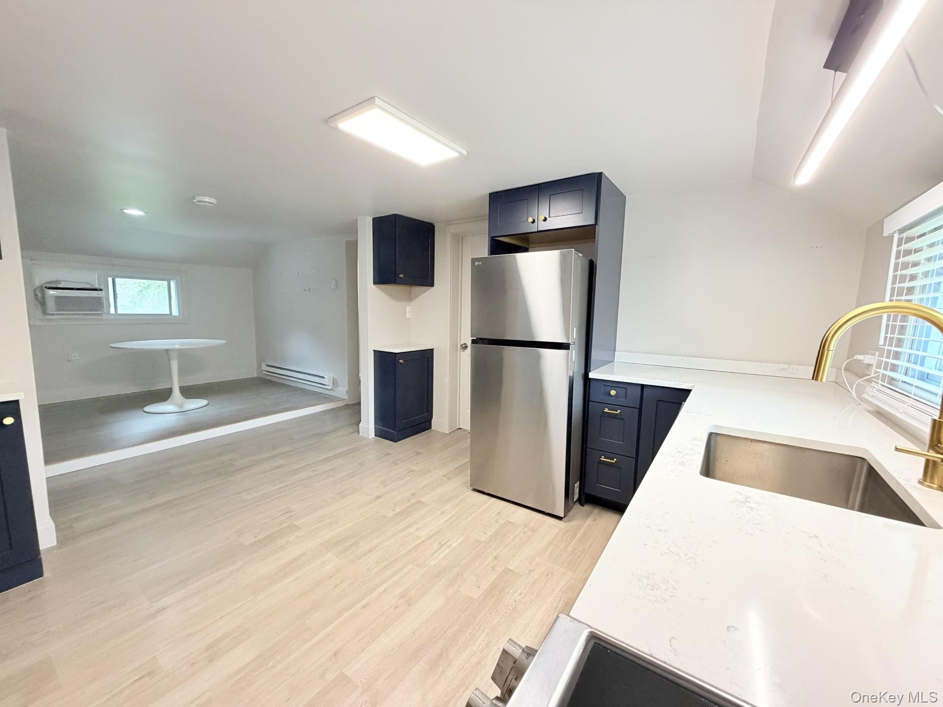 4 Lower Trinity Pass Road Pound Ridge, NY 10576 - Photo 19 of 29 a kitchen with stainless steel appliances kitchen island a refrigerator sink and stove