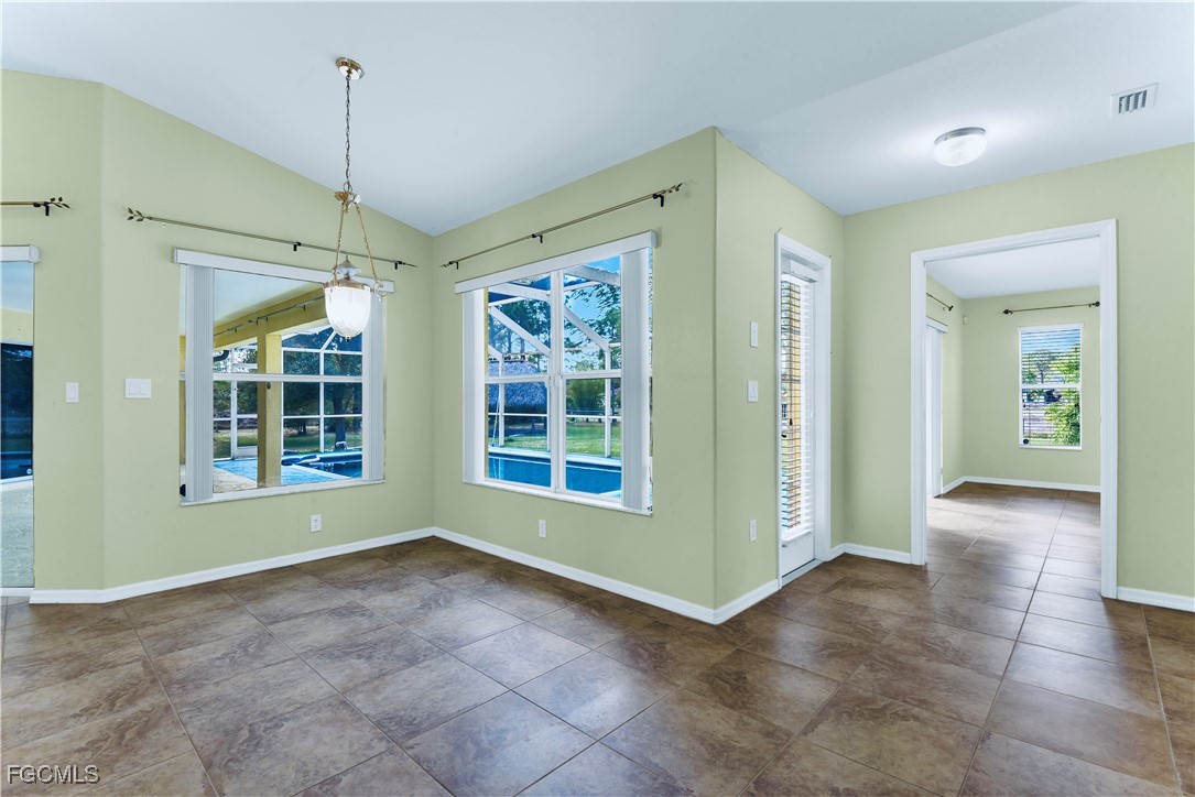 909 Magnolia Avenue Lehigh Acres, FL 33972 - Photo 23 of 38 a view of an empty room with a window
