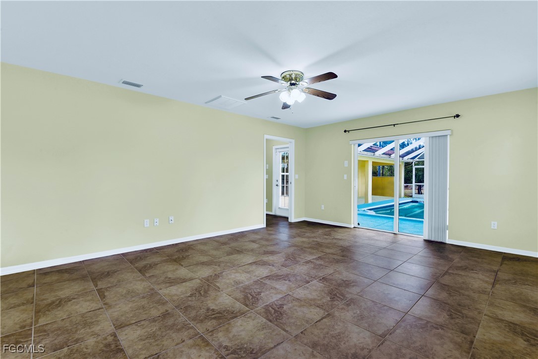909 Magnolia Avenue Lehigh Acres, FL 33972 - Photo 25 of 38 a view of an empty room with a window