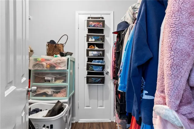 a room with closet and wooden floor