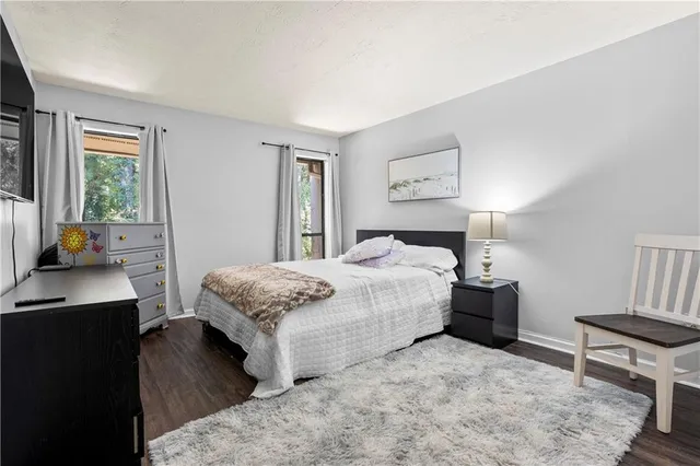 a bedroom with a bed and a desk