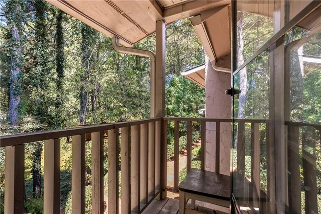 a view of a balcony with wooden floor