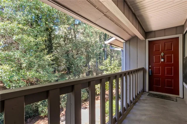 a view of a balcony with wooden floor