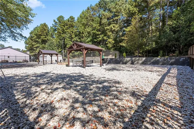 a house with trees in the background