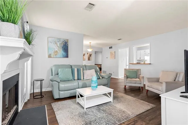 a living room with furniture and a fireplace