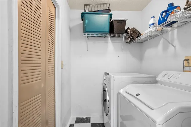 a utility room with dryer and washer