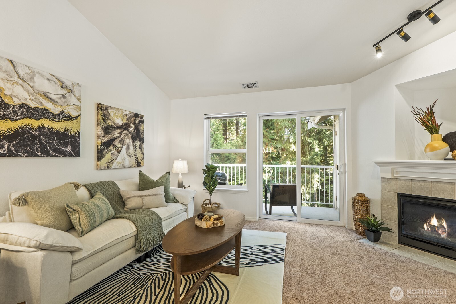 17204 123rd Place Northeast, Unit N304 Bothell, WA 98011 - Photo 13 of 40 a living room with furniture a window and a fireplace
