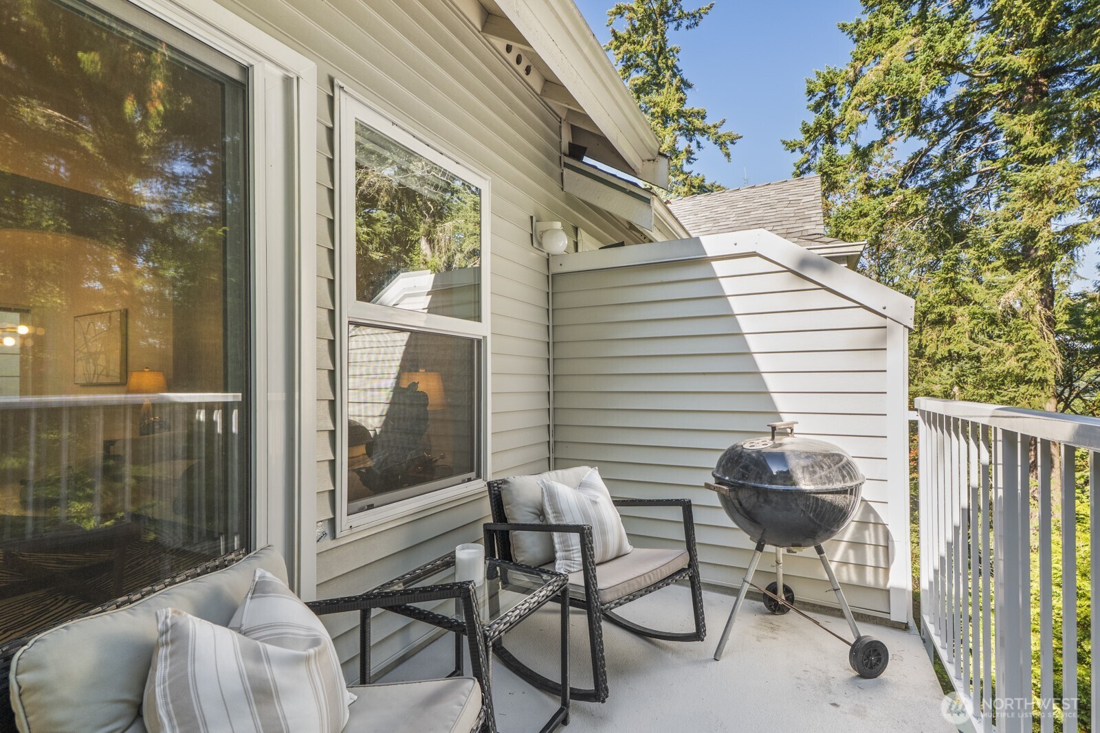 17204 123rd Place Northeast, Unit N304 Bothell, WA 98011 - Photo 16 of 40 a view of a patio with a table and chairs and couches